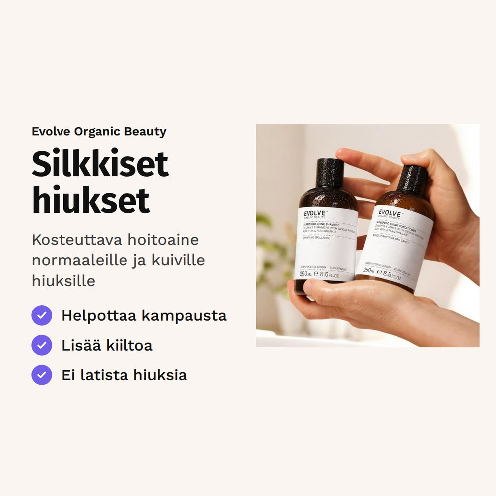 Evolve Superfood Shine Conditioner 250 ml. Silkkiset hiukset. Kosteuttava hoitoaine normaaleille ja kuiville hiuksille. Kuvassa kädet pitelevät shampoo- ja hoitoainepulloa.