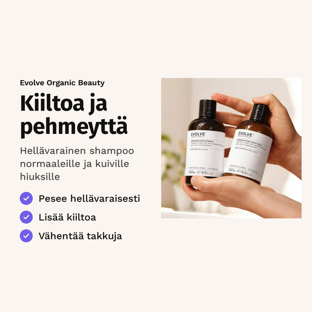 Evolve Superfood Shine Shampoo 250 ml. Kiiltoa ja pehmeyttä. Hellävarainen shampoo normaaleille ja kuiville hiuksille. Kuvassa kädet pitelevät shampoo- ja hoitoainepulloa.