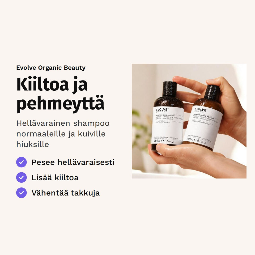 Evolve Superfood Shine Shampoo 250 ml. Kiiltoa ja pehmeyttä. Hellävarainen shampoo normaaleille ja kuiville hiuksille. Kuvassa kädet pitelevät shampoo- ja hoitoainepulloa.